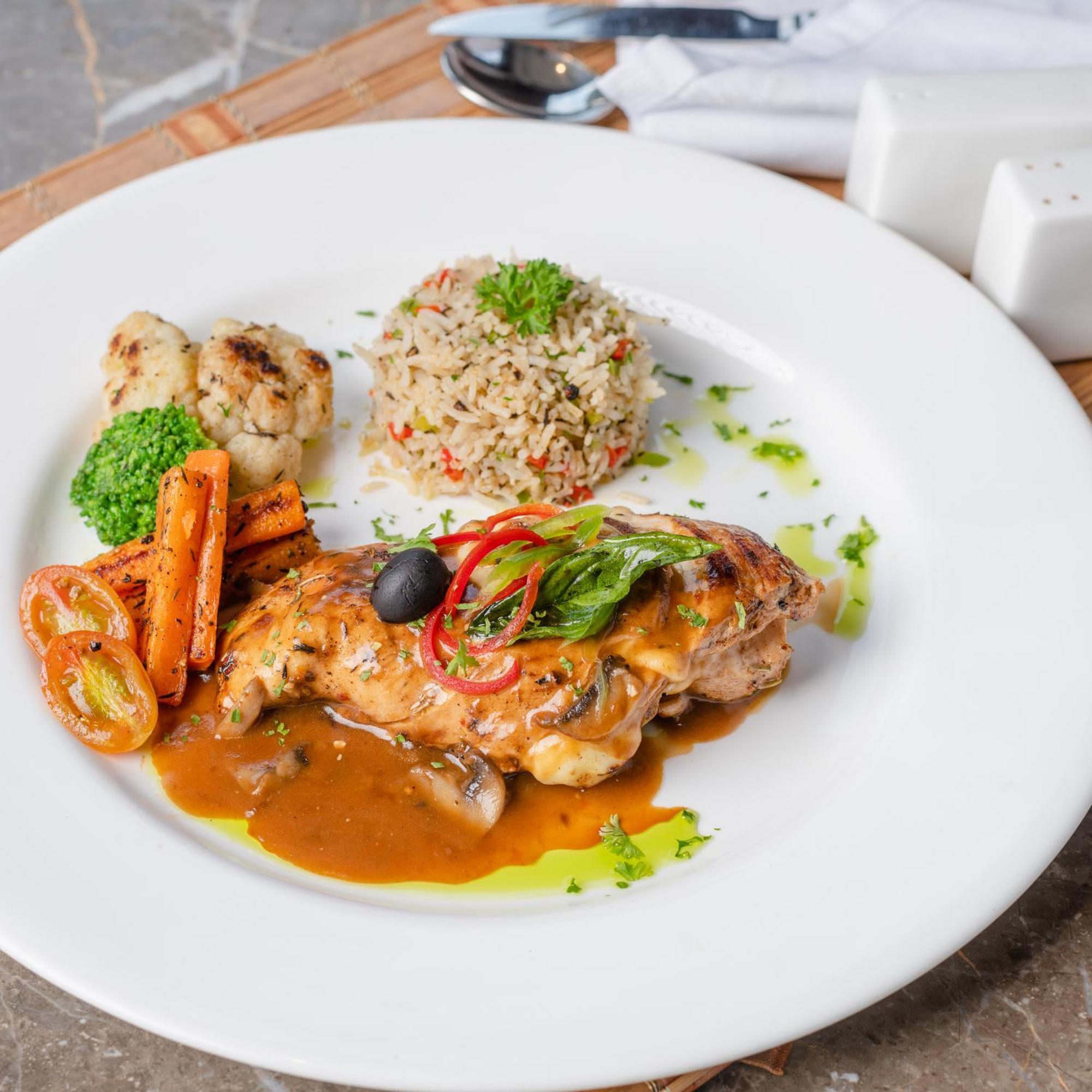 Southern Star,Mysore Exterior photo A plate of chicken with bulgur pilaf